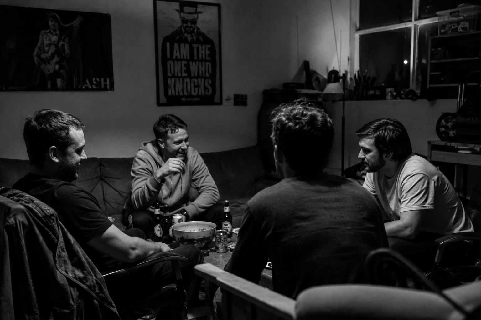 A group of mates in conversation late at night