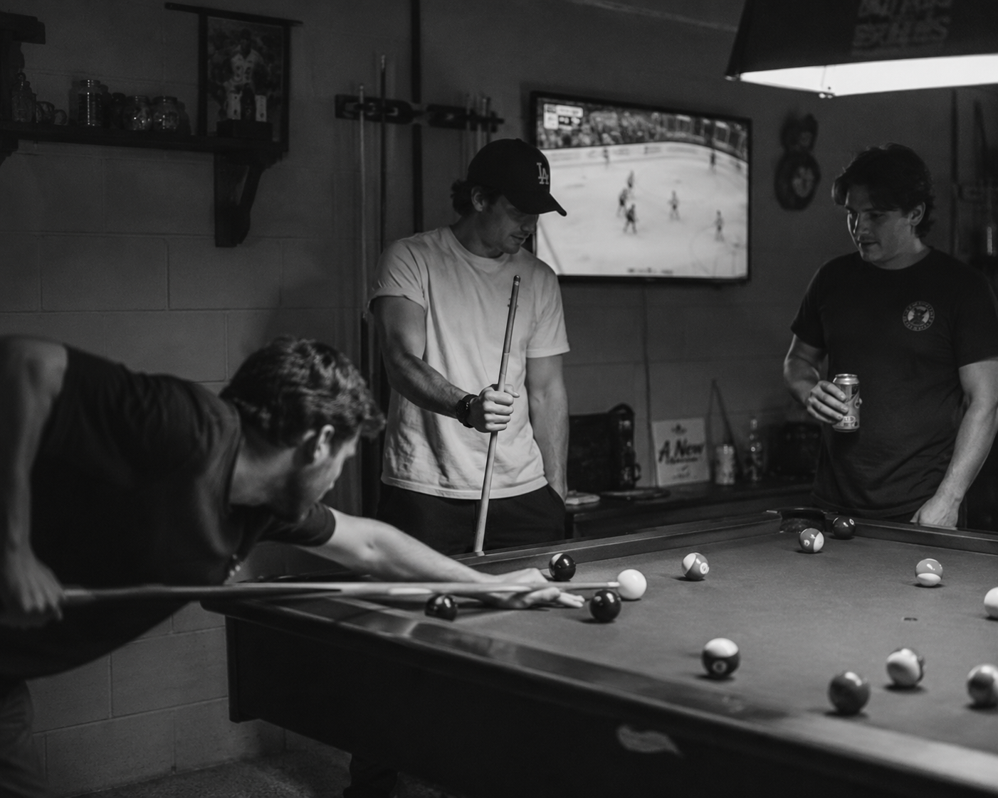 Mates spending time together around a pool table