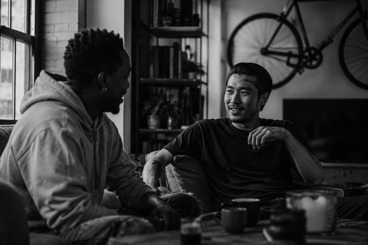 Two mates in conversation at home